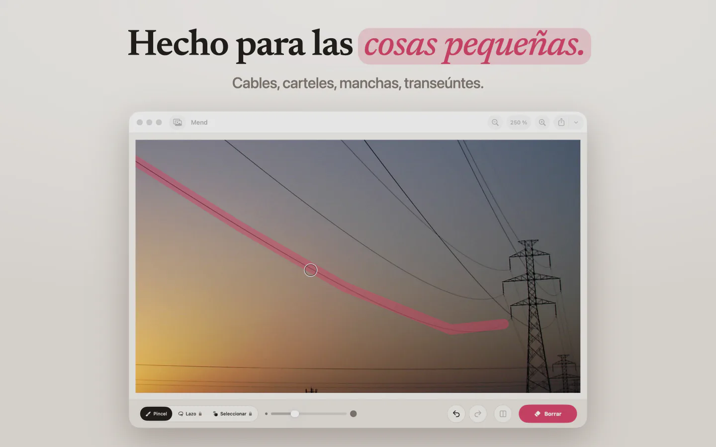 Mend en Mac con un trazo rosa a lo largo de un cable eléctrico que cruza el cielo del atardecer