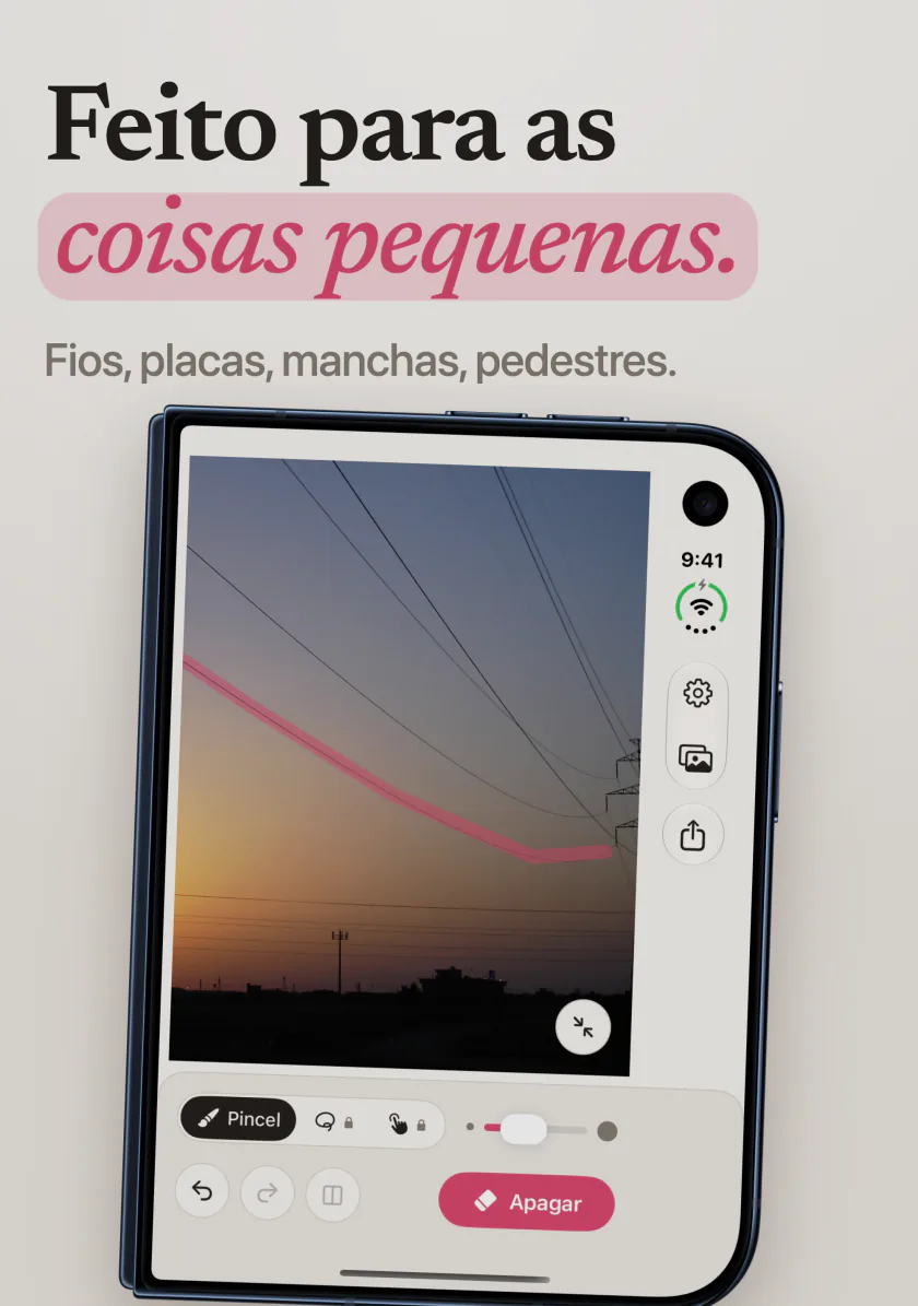 O Mend no iPhone Duo com um traço rosa ao longo de um fio de energia que cruza o céu do entardecer